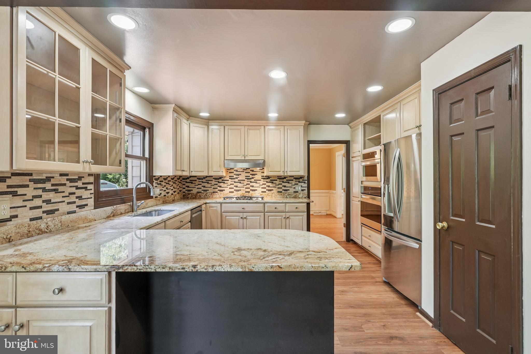 10 Rooftree Road Cherry Hill, NJ 08003 - Photo 14 of 58 a kitchen with stainless steel appliances granite countertop a sink and a refrigerator