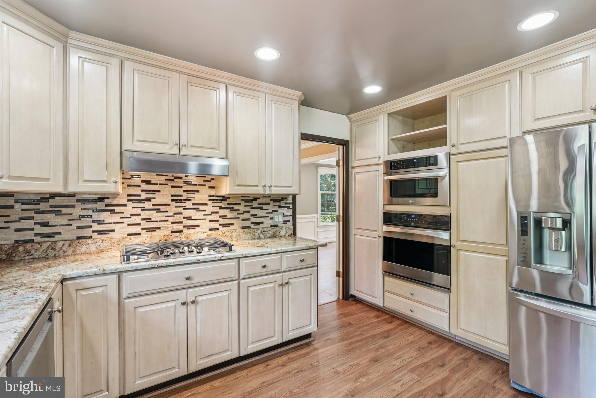 10 Rooftree Road Cherry Hill, NJ 08003 - Photo 15 of 58 a kitchen with granite countertop white cabinets and stainless steel appliances