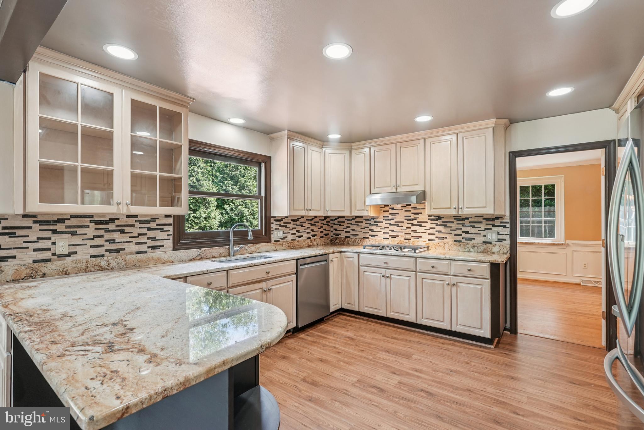 10 Rooftree Road Cherry Hill, NJ 08003 - Photo 16 of 58 a kitchen with stainless steel appliances granite countertop wooden cabinets and a granite counter tops with a large window