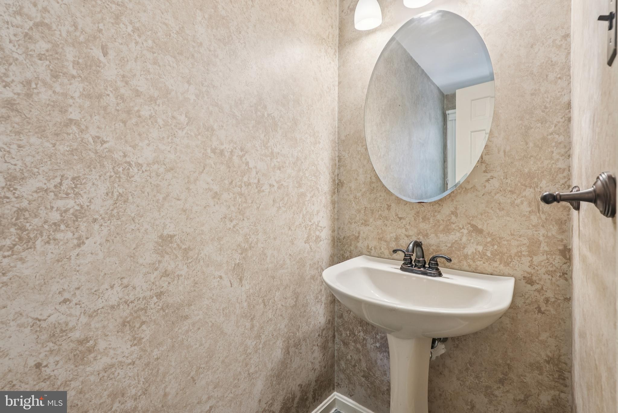 10 Rooftree Road Cherry Hill, NJ 08003 - Photo 21 of 58 a bathroom with a sink and a mirror