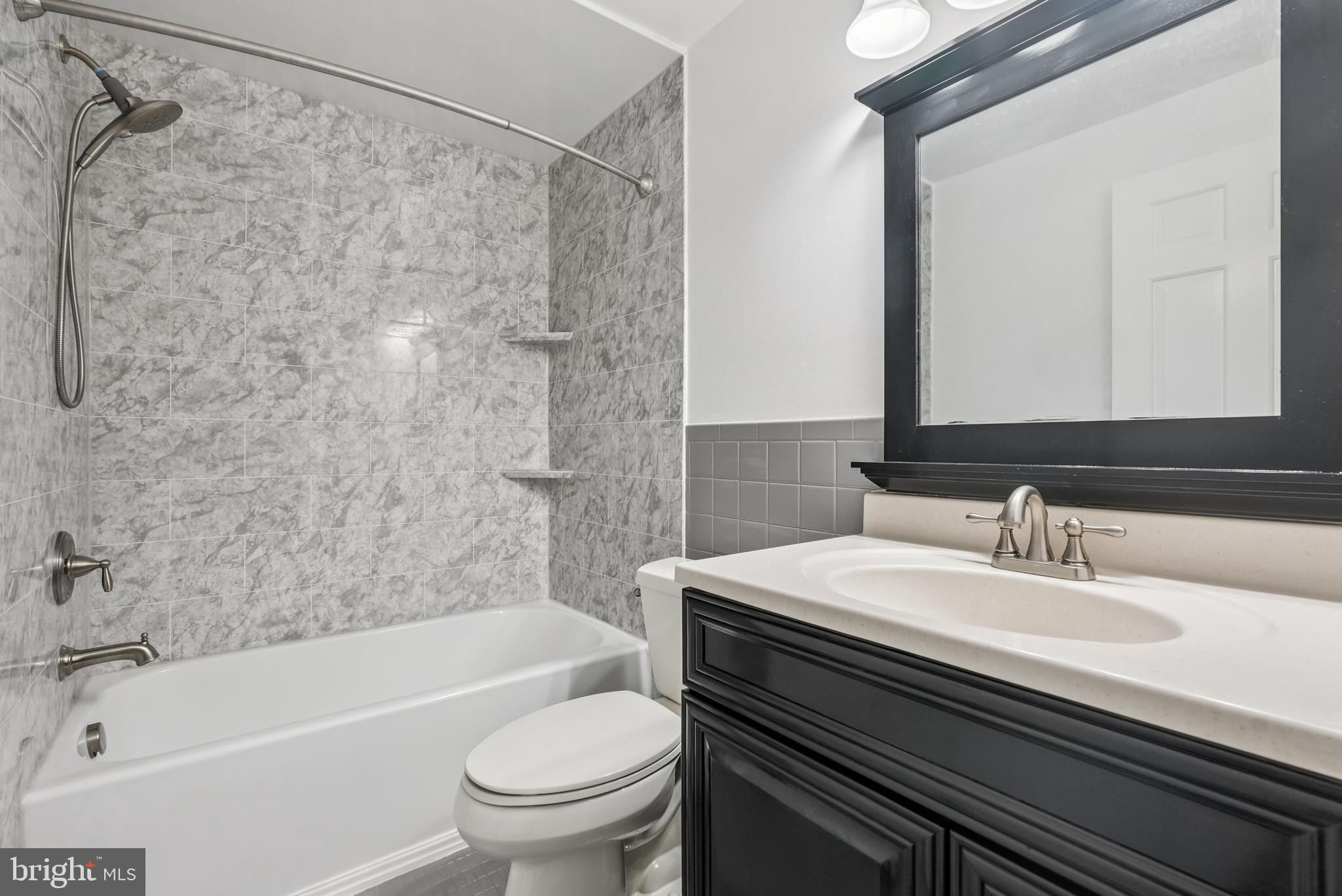 10 Rooftree Road Cherry Hill, NJ 08003 - Photo 24 of 58 a bathroom with a sink a toilet and a bathtub