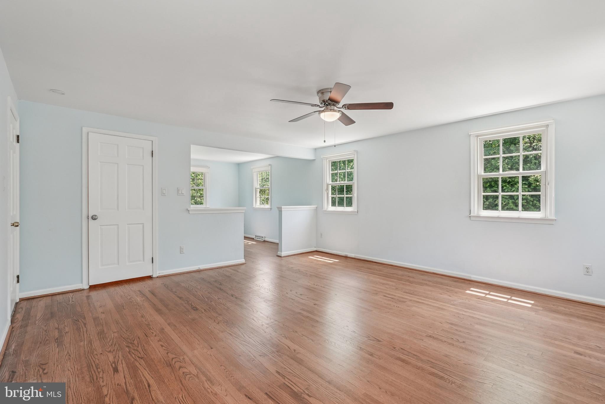 10 Rooftree Road Cherry Hill, NJ 08003 - Photo 25 of 58 a view of an empty room with a window and wooden floor