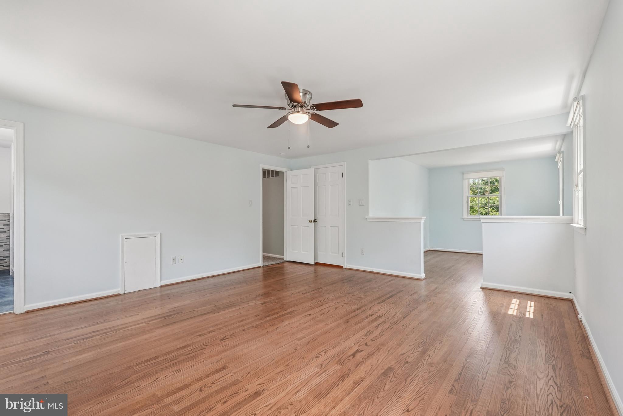 10 Rooftree Road Cherry Hill, NJ 08003 - Photo 26 of 58 an empty room with wooden floor and windows