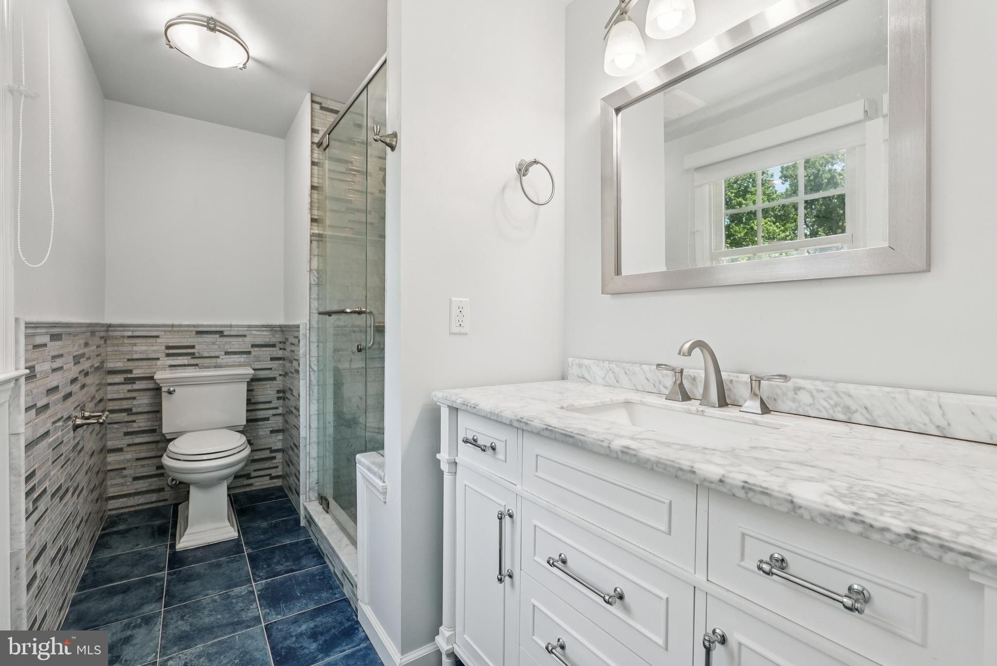 10 Rooftree Road Cherry Hill, NJ 08003 - Photo 28 of 58 a bathroom with a granite countertop sink toilet and shower