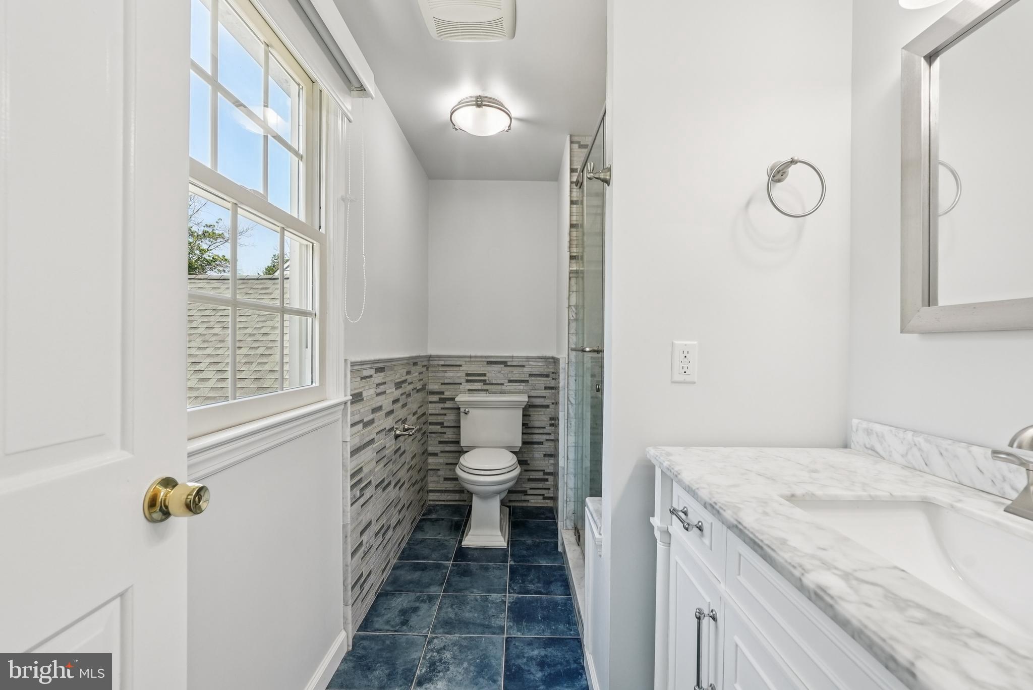 10 Rooftree Road Cherry Hill, NJ 08003 - Photo 30 of 58 a bathroom with a granite countertop sink a toilet and a shower