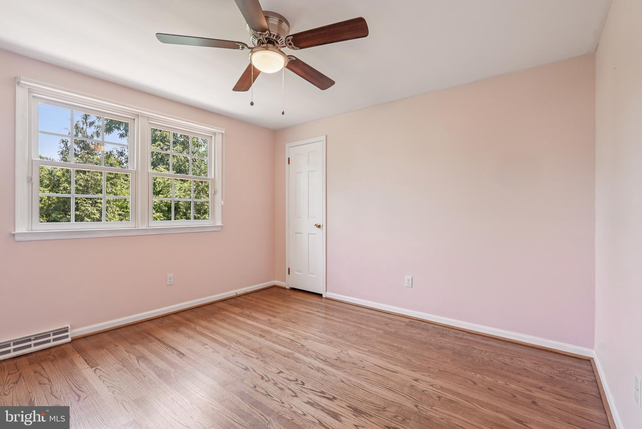 10 Rooftree Road Cherry Hill, NJ 08003 - Photo 36 of 58 an empty room with wooden floor fan and windows