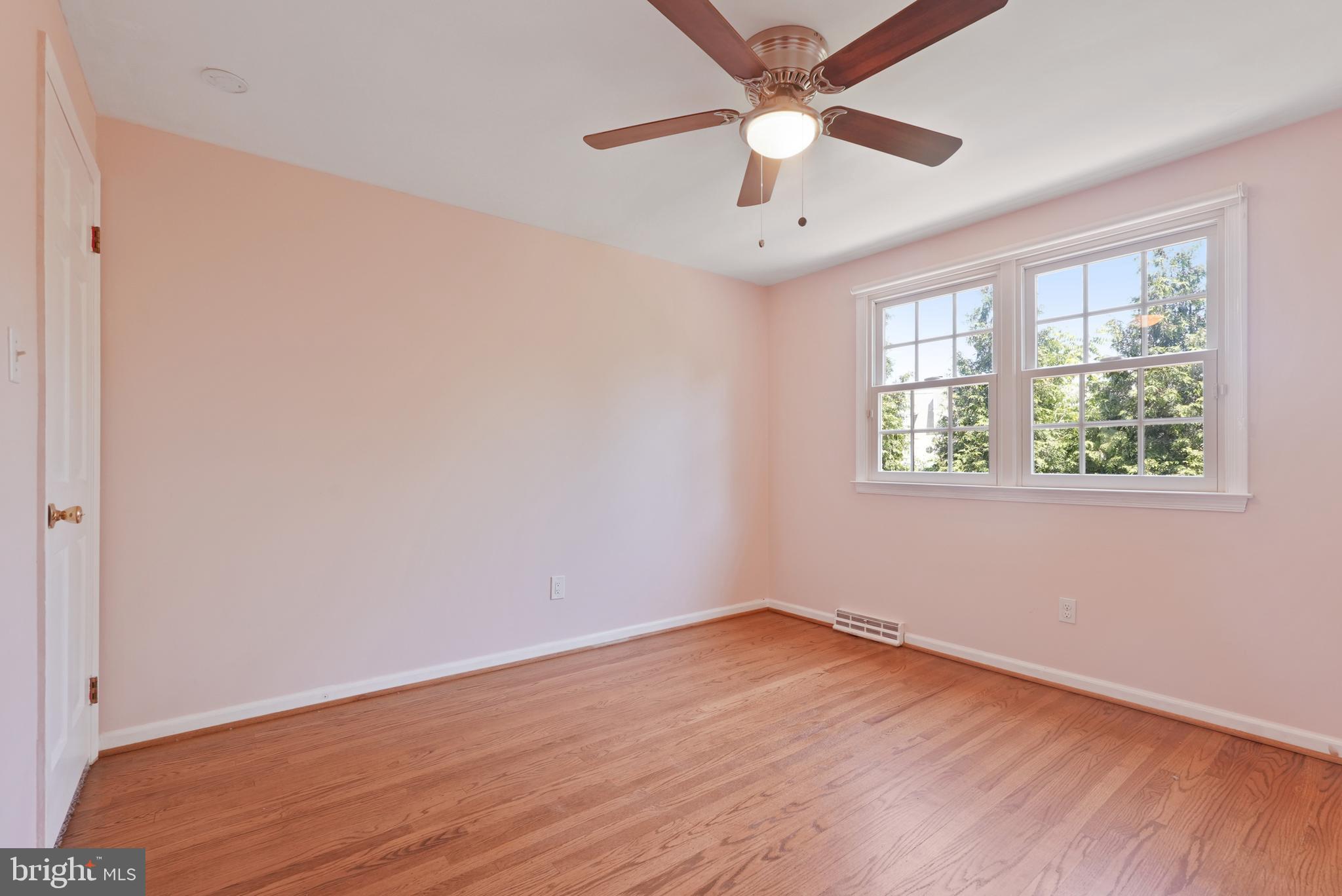 10 Rooftree Road Cherry Hill, NJ 08003 - Photo 37 of 58 an empty room with wooden floor fan and windows
