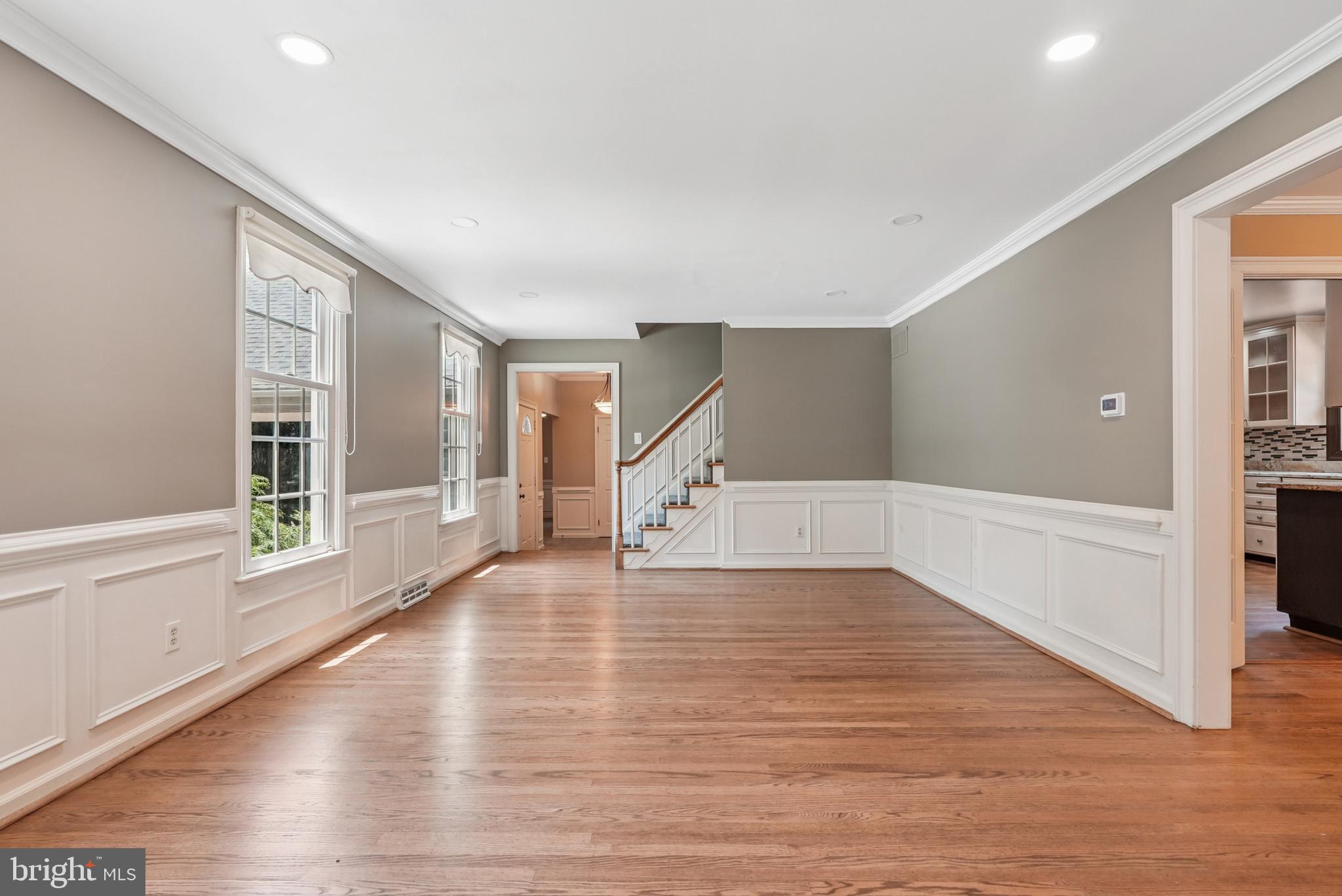 10 Rooftree Road Cherry Hill, NJ 08003 - Photo 5 of 58 a view of an empty room with wooden floor and a window