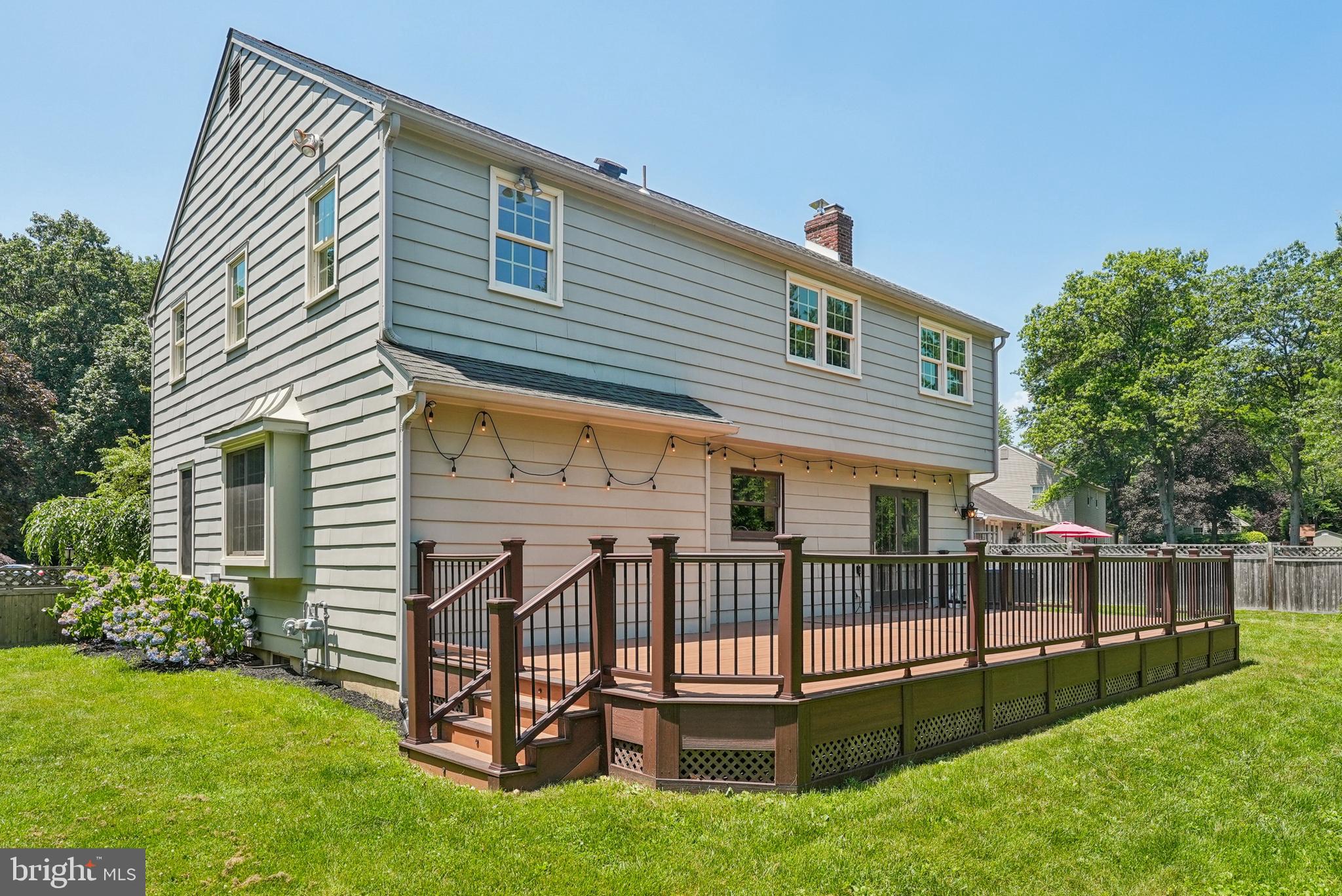 10 Rooftree Road Cherry Hill, NJ 08003 - Photo 55 of 58 a front view of a house with backyard and deck