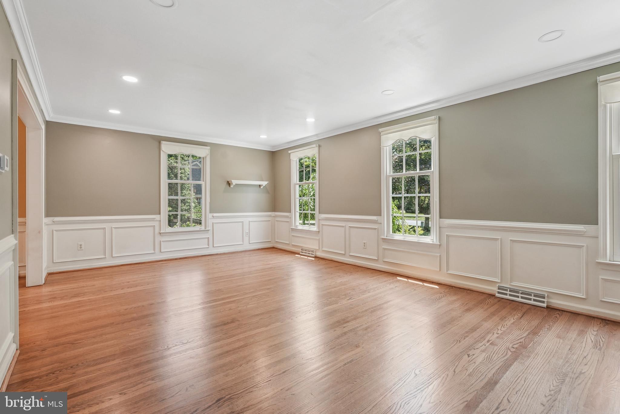 10 Rooftree Road Cherry Hill, NJ 08003 - Photo 7 of 58 an empty room with wooden floor and windows