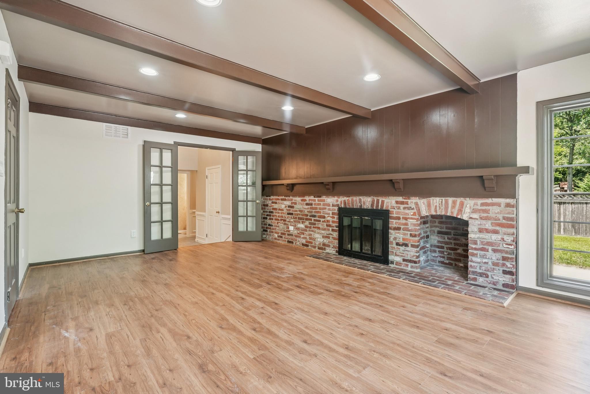 10 Rooftree Road Cherry Hill, NJ 08003 - Photo 9 of 58 a view of an empty room with a fireplace and a window
