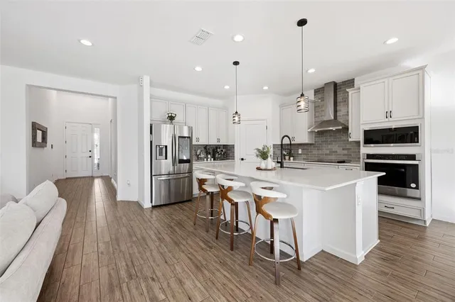 a bathroom with a double vanity sink a mirror and a shower