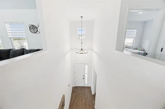 a living room with furniture a rug and a window