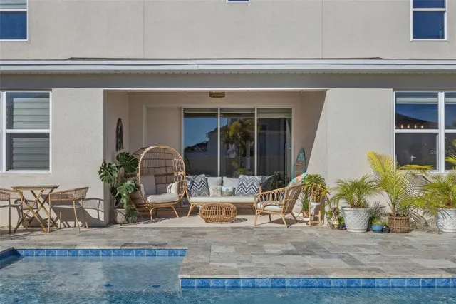 an aerial view of a house with a swimming pool