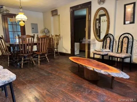 a kitchen with a sink appliances cabinets and a window