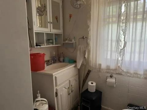 a view of a balcony with furniture and a window