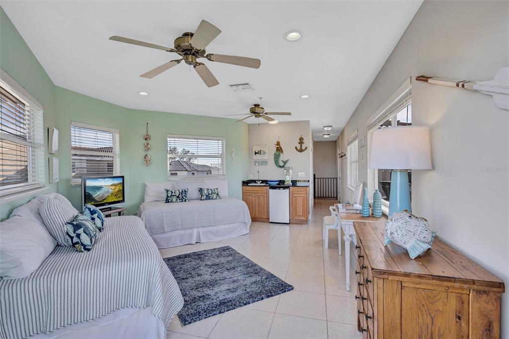 436 Canal Road, Unit A Sarasota, FL 34242 - Photo 64 of 94 a living room with furniture and a chandelier