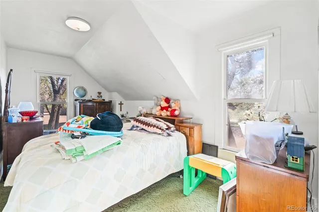 a bedroom with furniture and a bed