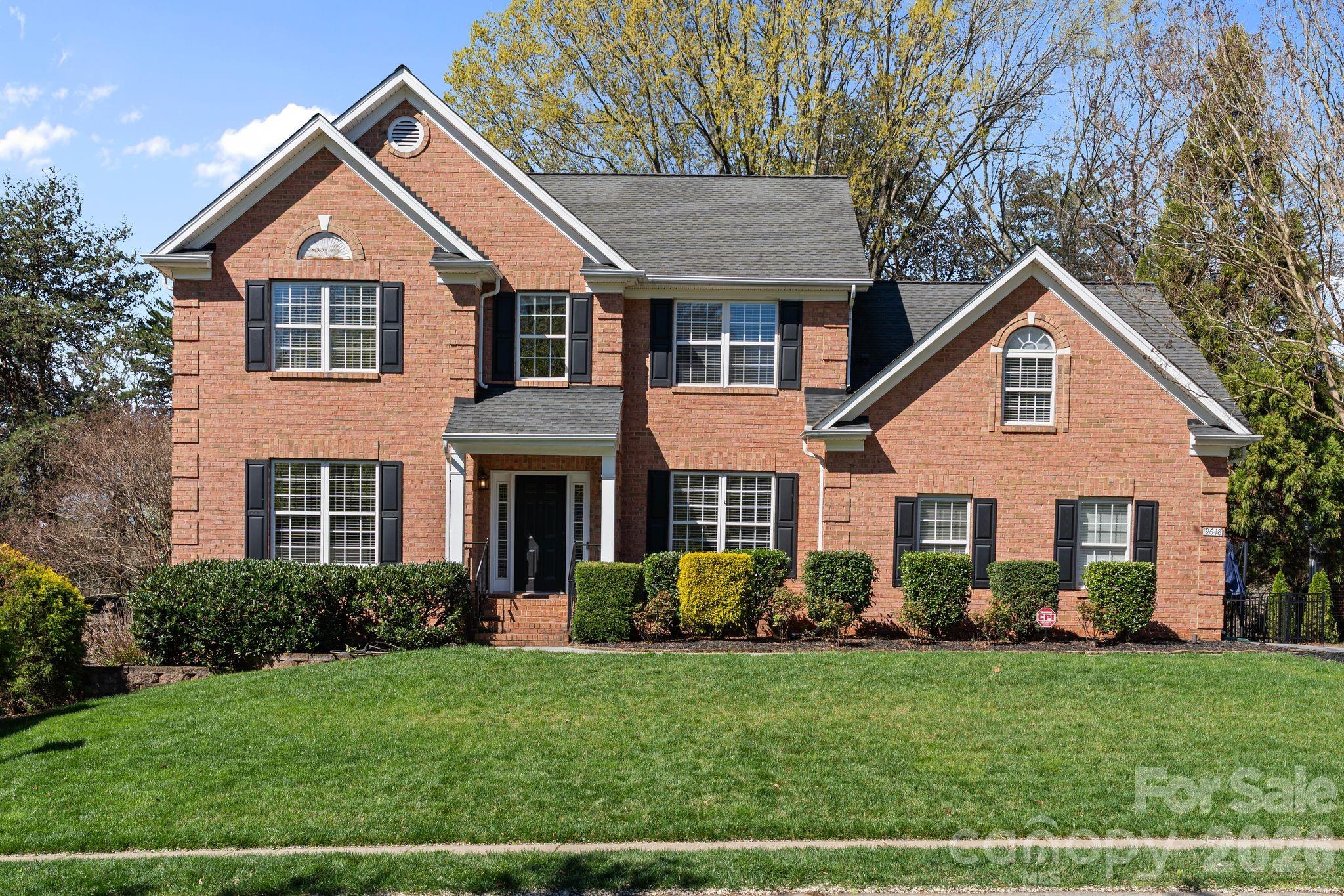 9618 Cockerham Lane Huntersville, NC 28078 - Photo 1 of 37 a front view of a house with a yard and green space