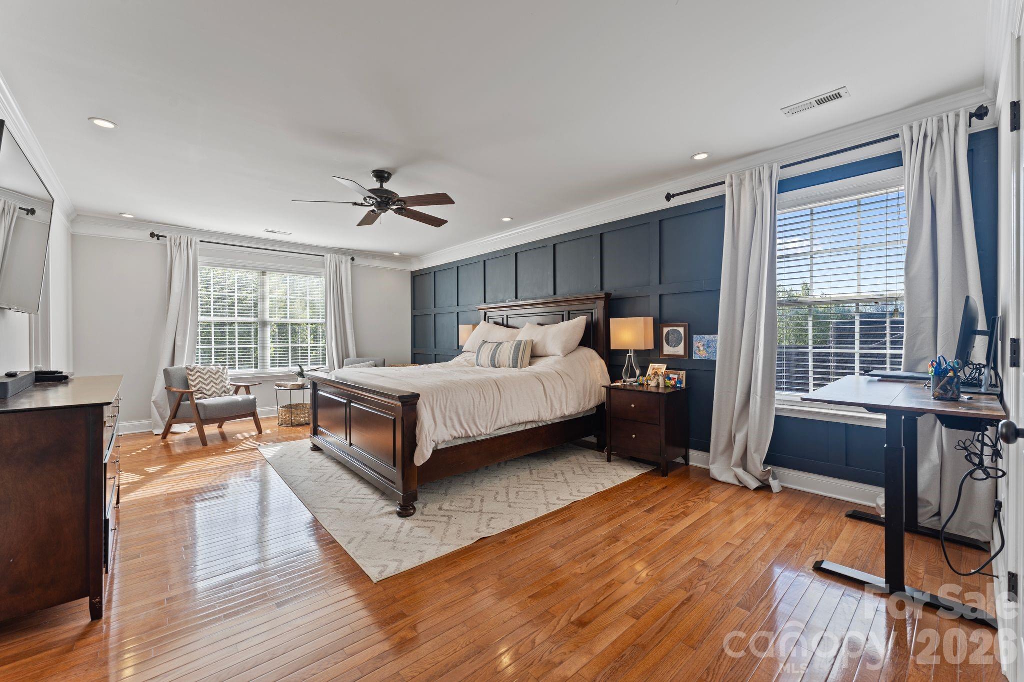 9618 Cockerham Lane Huntersville, NC 28078 - Photo 16 of 37 a spacious bedroom with a bed and a table in it