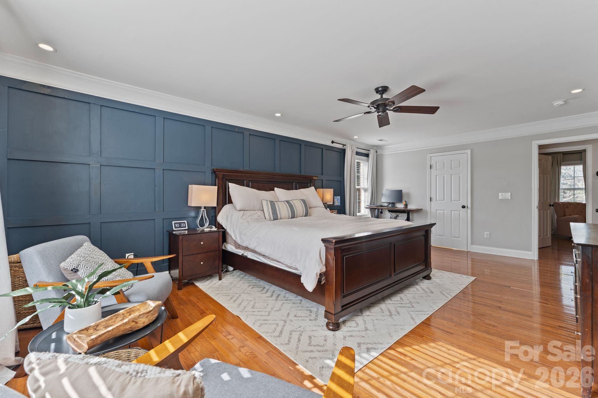 9618 Cockerham Lane Huntersville, NC 28078 - Photo 17 of 37 a bedroom with a bed and a chandelier