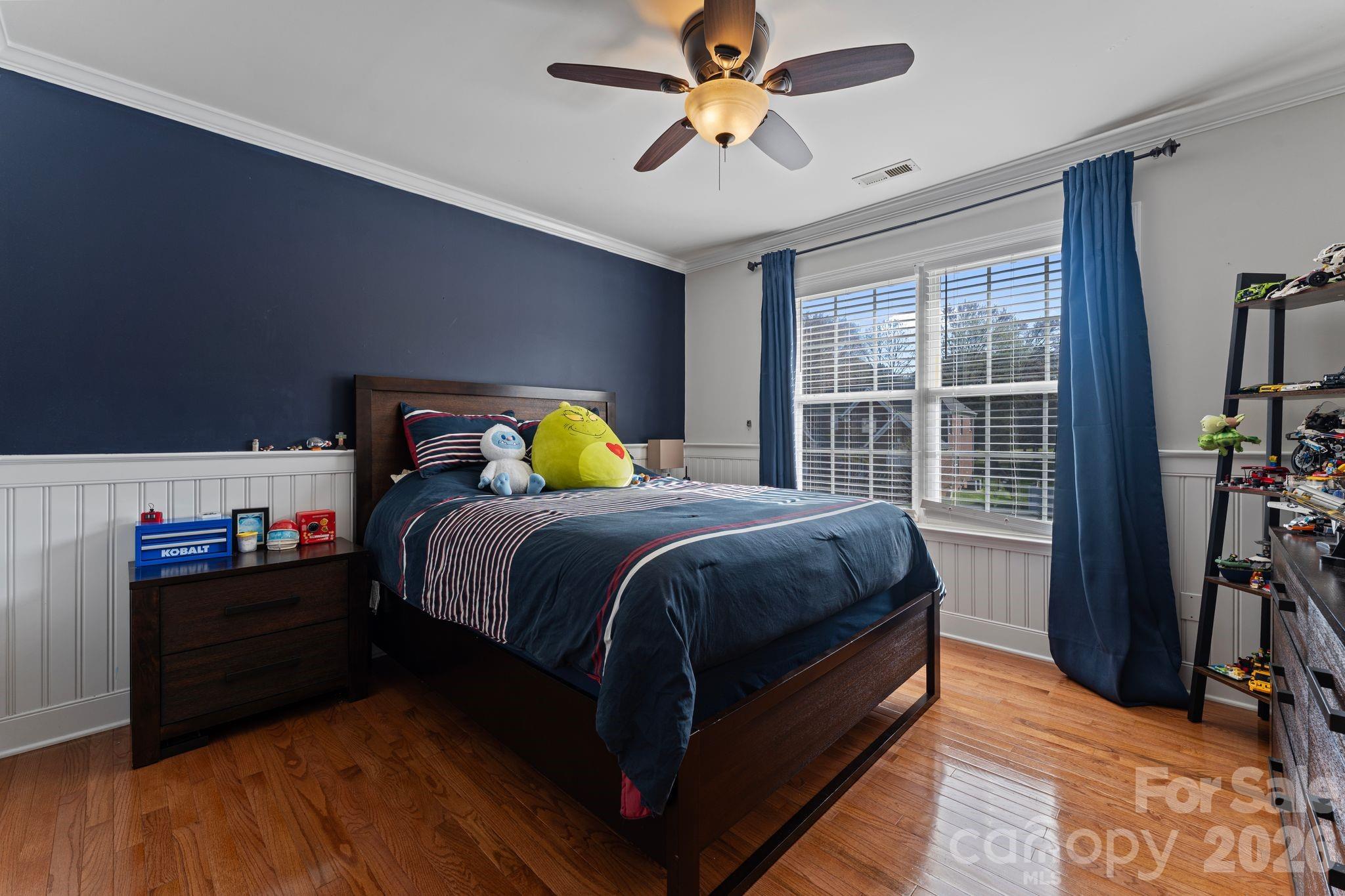 9618 Cockerham Lane Huntersville, NC 28078 - Photo 20 of 37 a bedroom with bed and wooden floor
