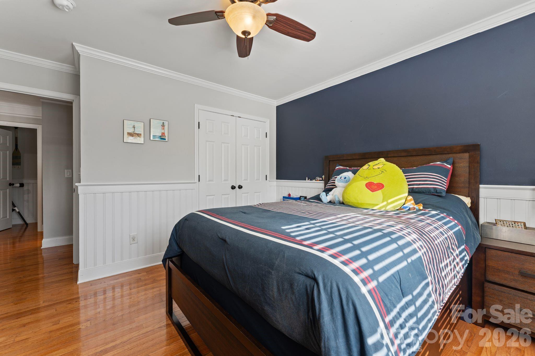 9618 Cockerham Lane Huntersville, NC 28078 - Photo 21 of 37 a bedroom with a bed and wooden floor