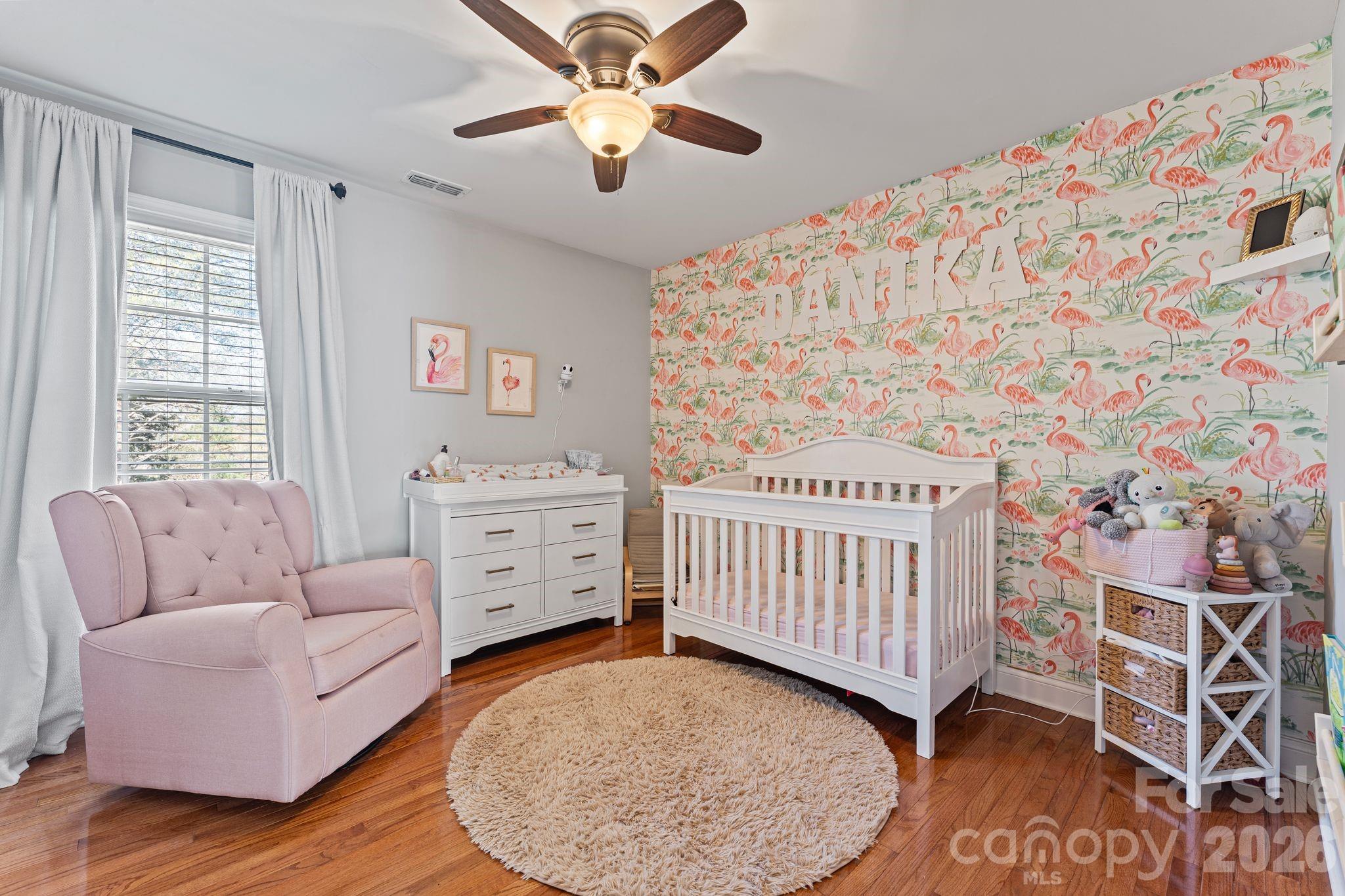 9618 Cockerham Lane Huntersville, NC 28078 - Photo 23 of 37 a living room with furniture and a baby crib