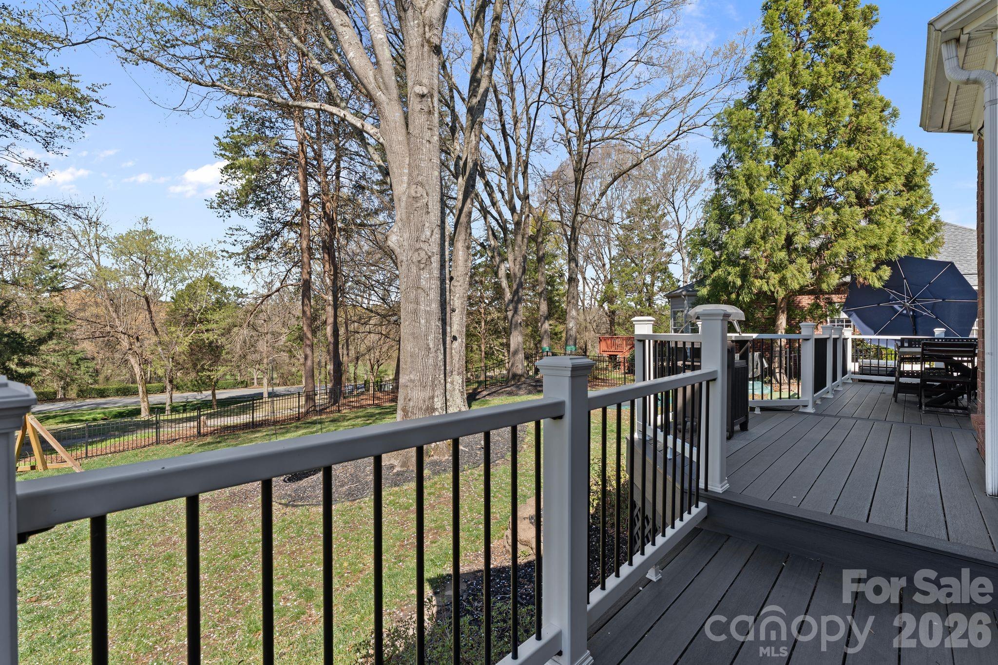 9618 Cockerham Lane Huntersville, NC 28078 - Photo 29 of 37 a view of a wooden deck with a trees