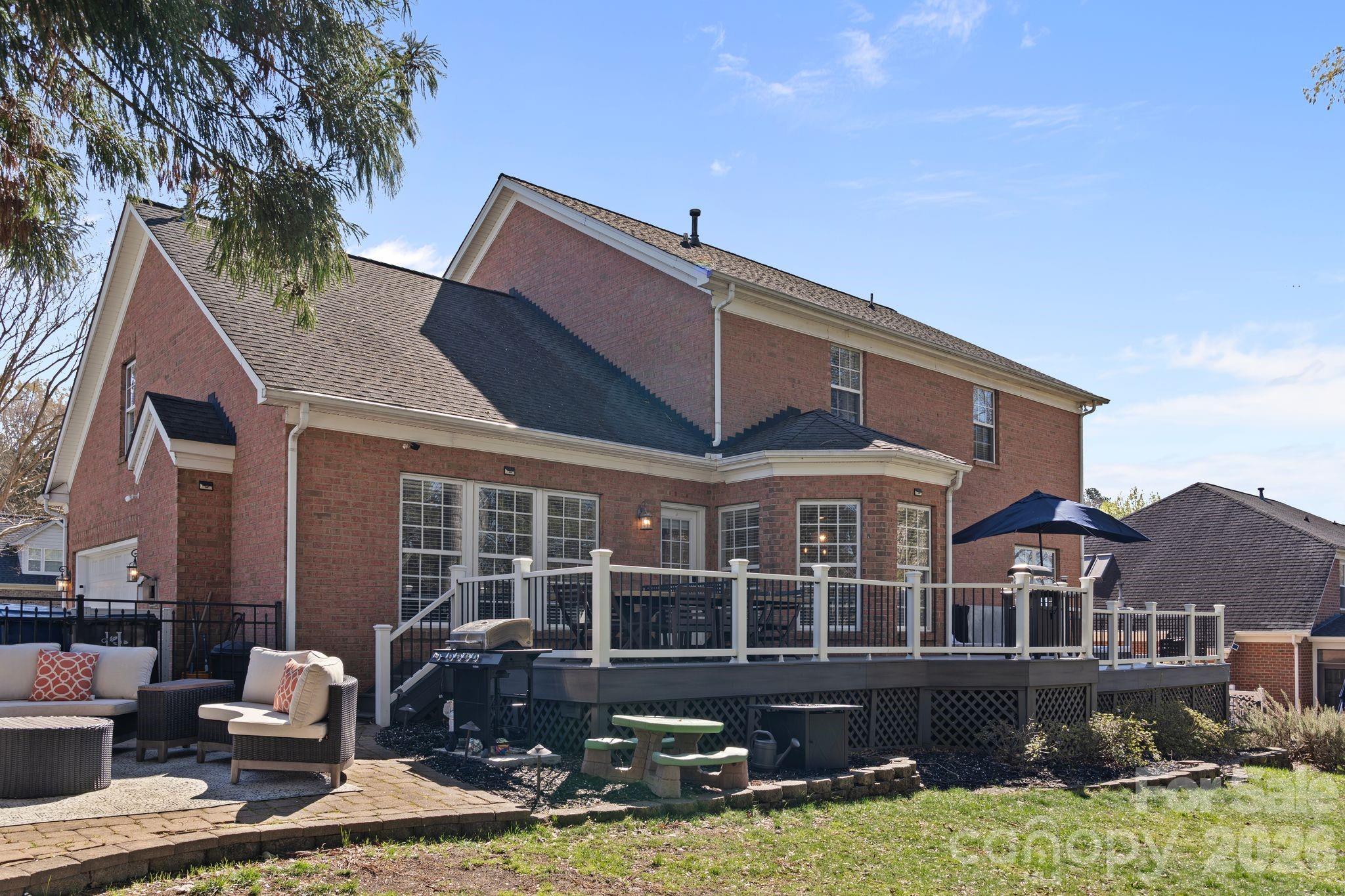 9618 Cockerham Lane Huntersville, NC 28078 - Photo 32 of 37 a front view of a house with yard and seating