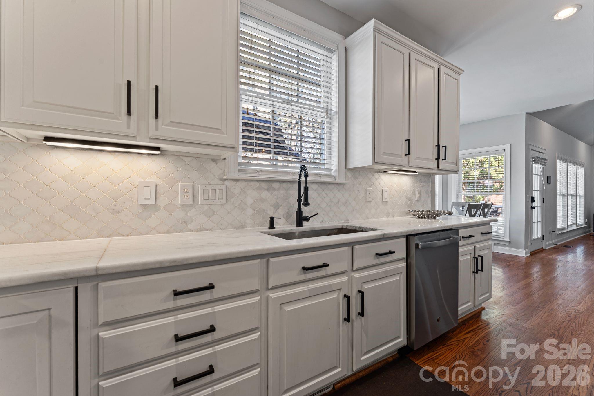9618 Cockerham Lane Huntersville, NC 28078 - Photo 10 of 37 a kitchen with granite countertop white cabinets and white appliances