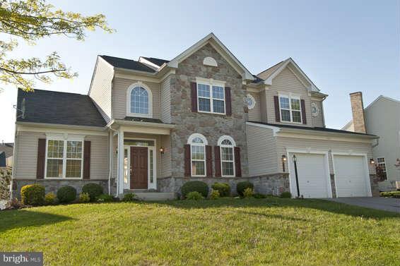 11012 Old York Road Bowie, MD 20721 - Photo 2 of 30 a front view of a house with a yard and garage