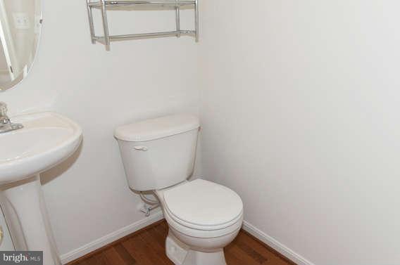 11012 Old York Road Bowie, MD 20721 - Photo 14 of 30 a white toilet sitting next to a white sink