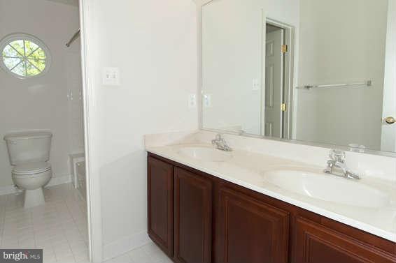 11012 Old York Road Bowie, MD 20721 - Photo 19 of 30 a bathroom with a sink and a mirror