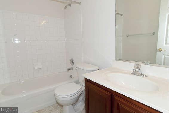 11012 Old York Road Bowie, MD 20721 - Photo 29 of 30 a bathroom with a sink a toilet and shower