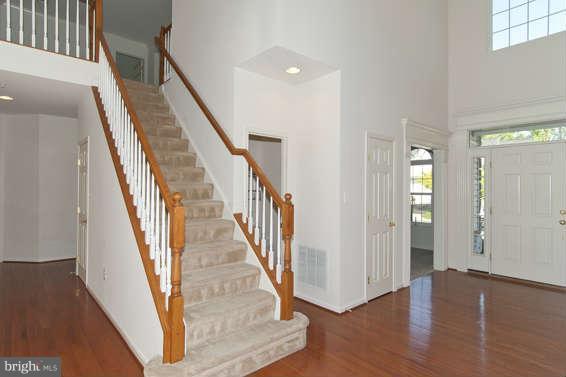 11012 Old York Road Bowie, MD 20721 - Photo 5 of 30 a view of an entryway with wooden floor and stairs