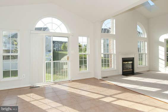 11012 Old York Road Bowie, MD 20721 - Photo 8 of 30 a view of a livingroom with wooden floor and a large window