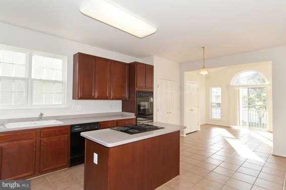 11012 Old York Road Bowie, MD 20721 - Photo 10 of 30 a kitchen that has a sink and a stove in it