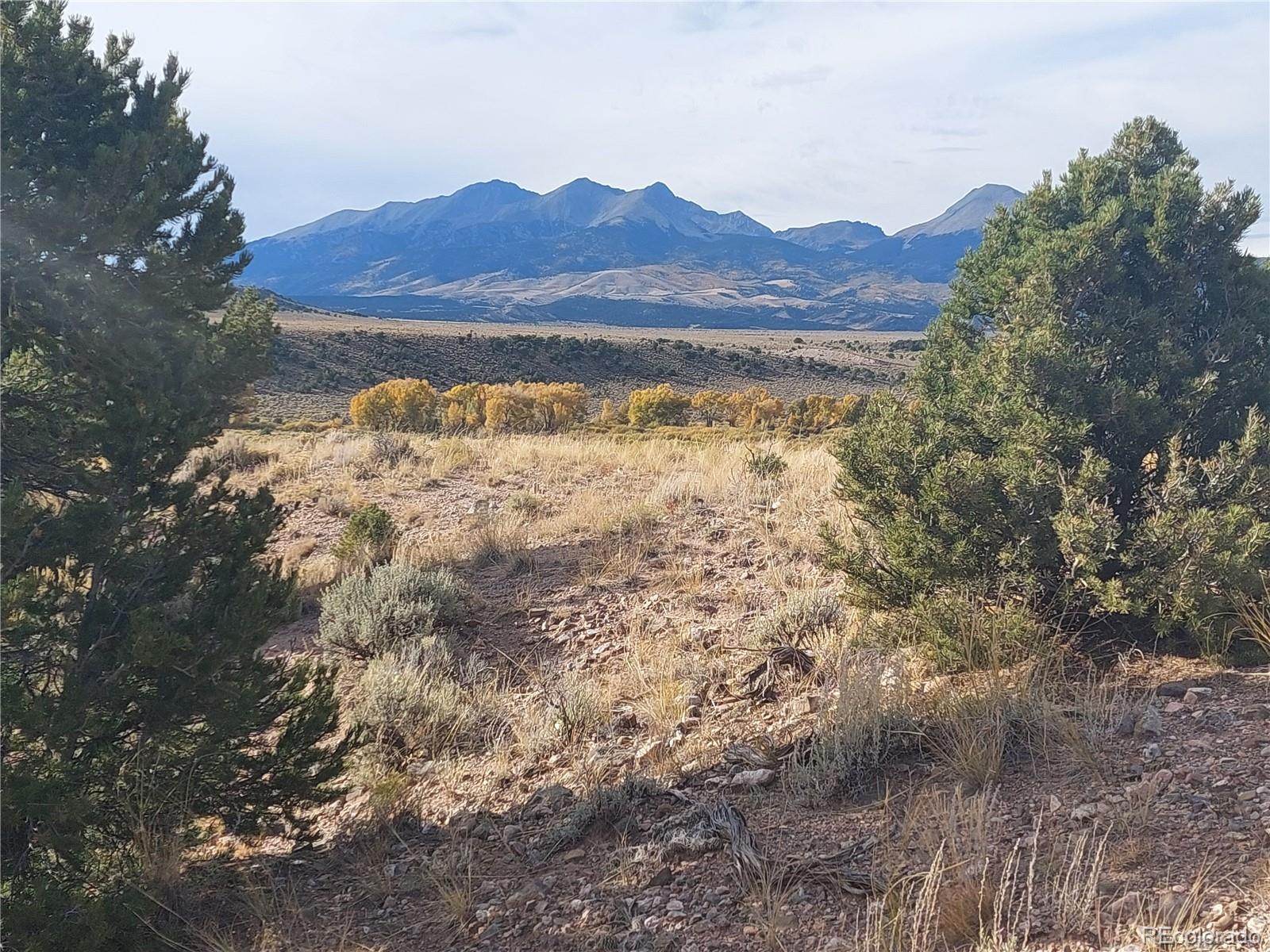 Lot 4132 Barker Road Fort Garland, CO 81133 - Photo 2 of 8 a view of lake with mountain in the background