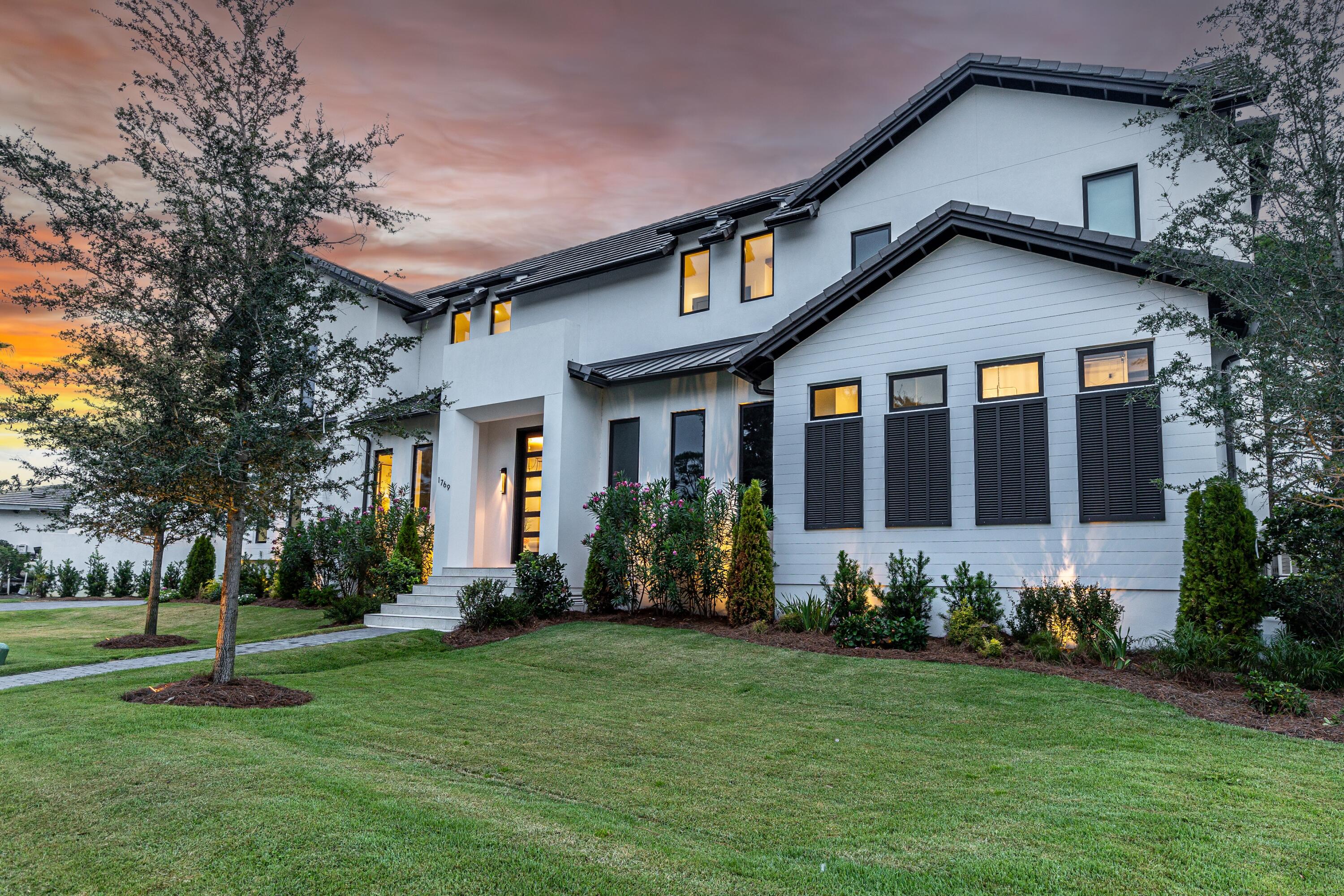 1769 Driftwood Point Road Santa Rosa Beach, FL 32459 - Photo 54 of 70 a front view of a house with a yard