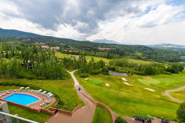 a view of a swimming pool with a yard
