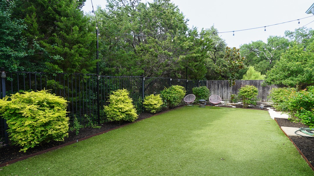 629 Germander Road Leander, TX 78641 - Photo 34 of 38 a view of a wooden bench sitting in the middle of a garden