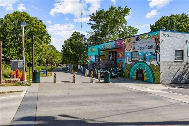 a view of street with small buildings