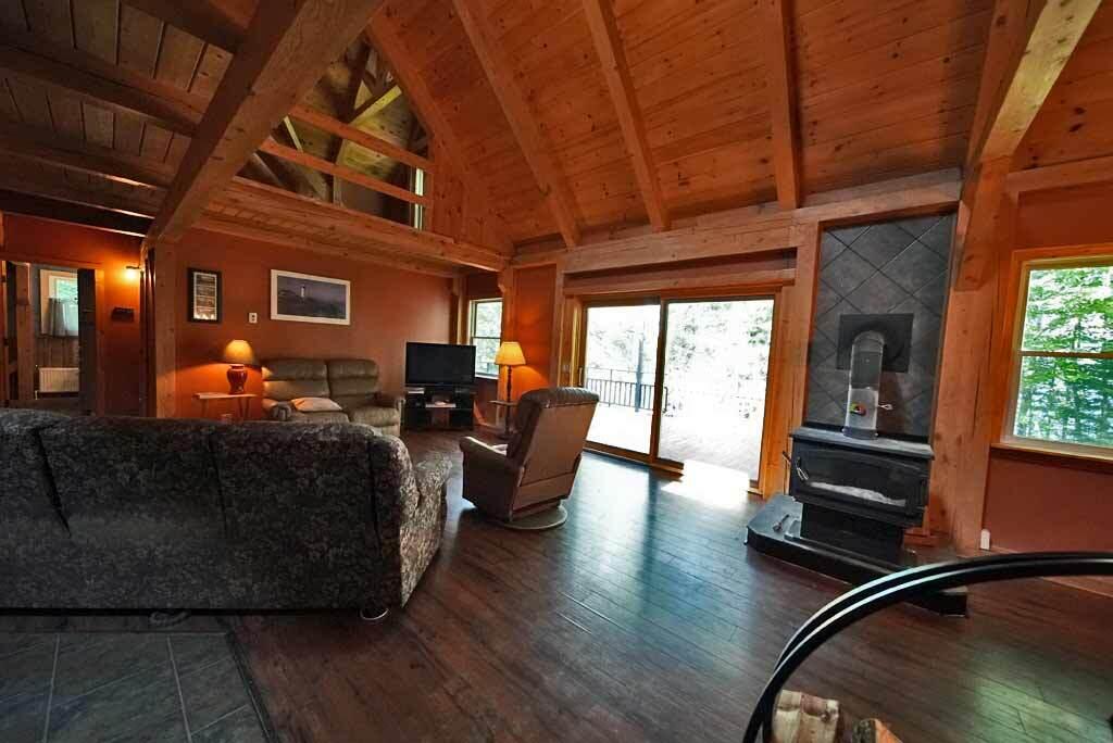 590 W Road Portage, ME 04768 - Photo 24 of 136 living-room-lake-home