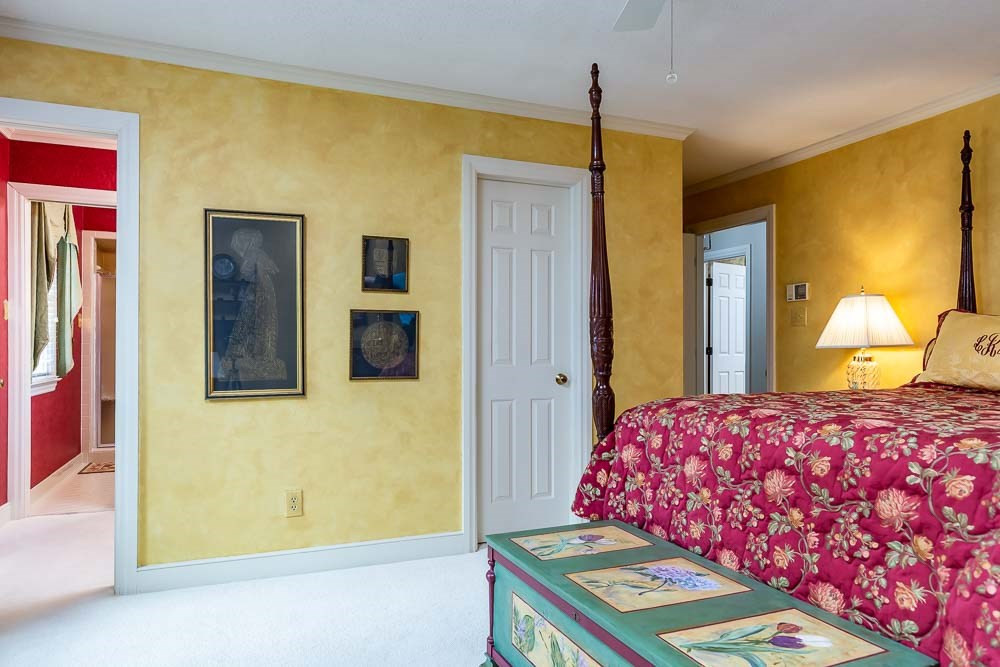 2304 Wheeler Road Raleigh, NC 27612 - Photo 18 of 30 a bedroom with a bed and a lamp next to a window