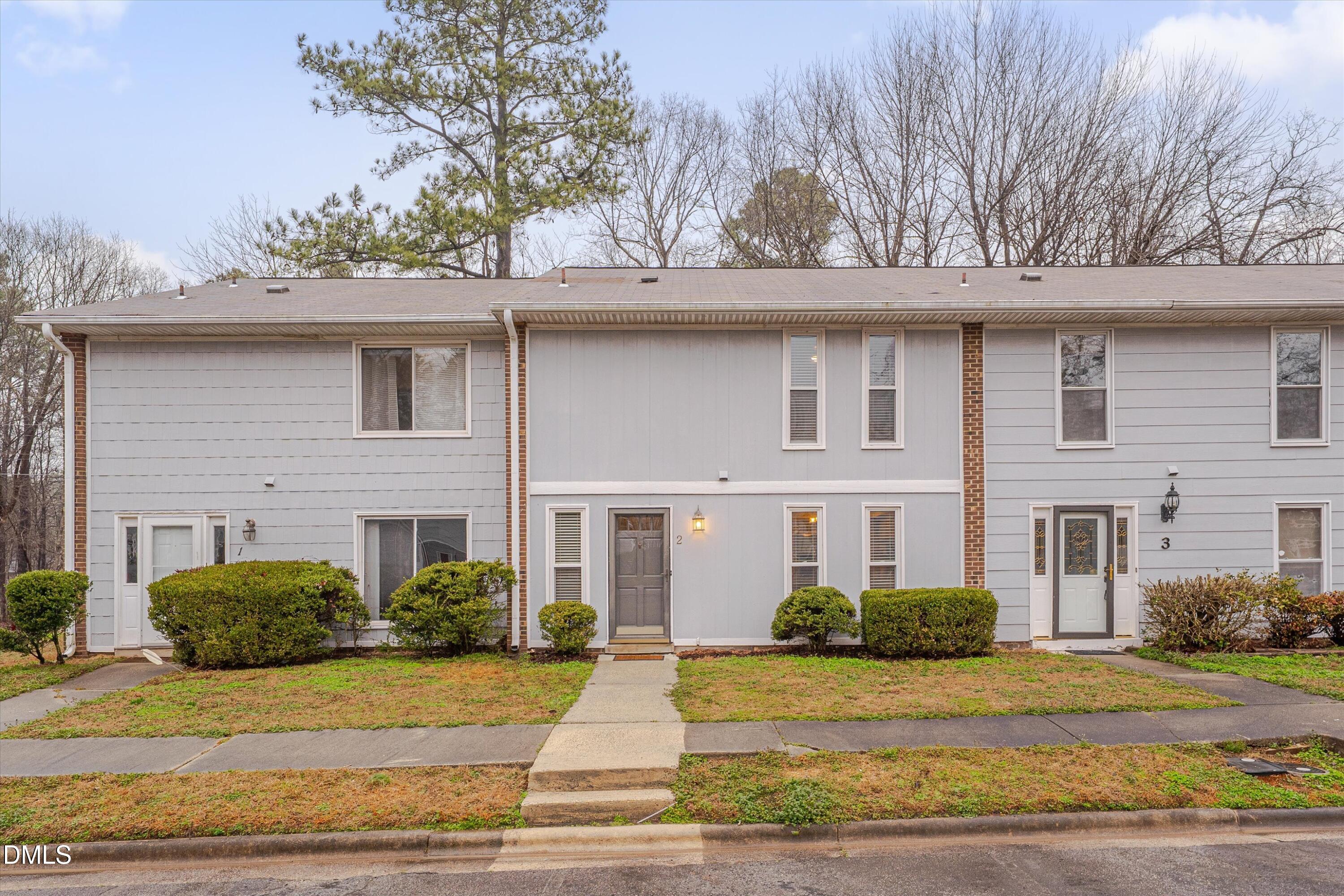 1304 Seaton Road, Unit 2 Durham, NC 27713 - Photo 1 of 19 a view of a house with a tree in front