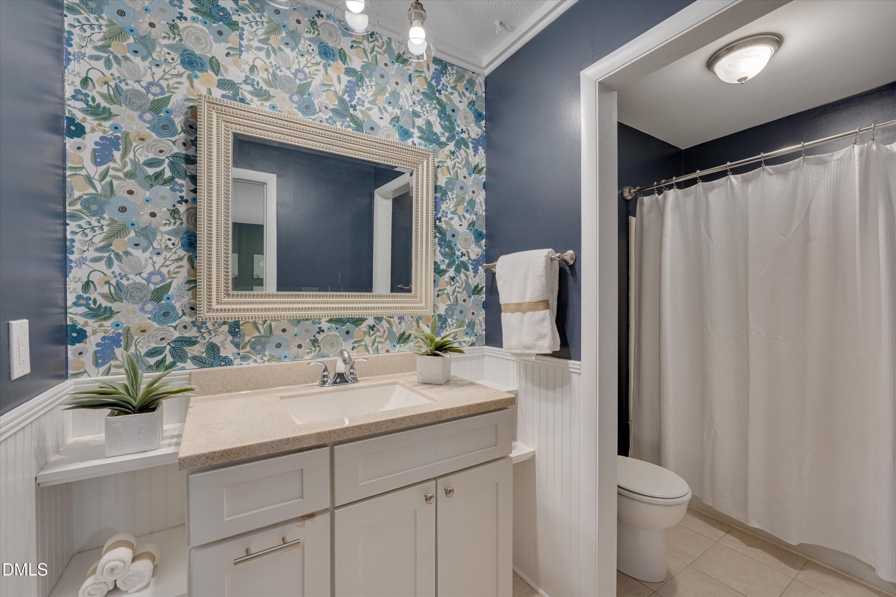 1304 Seaton Road, Unit 2 Durham, NC 27713 - Photo 13 of 19 a bathroom with a sink and a mirror
