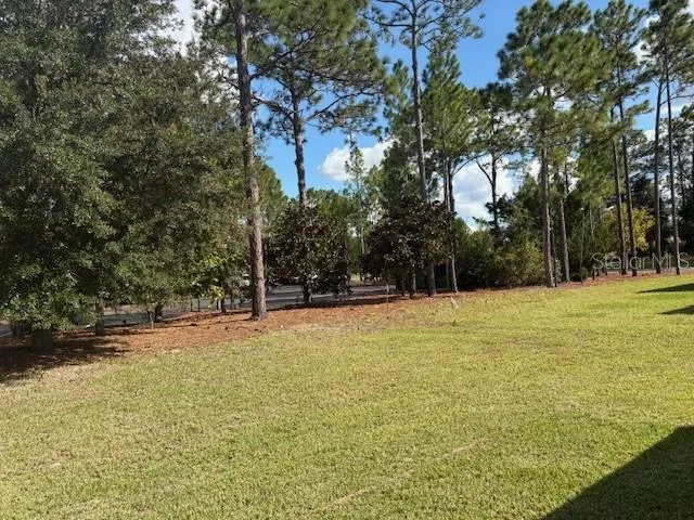 a view of a swimming pool with an outdoor space and seating area