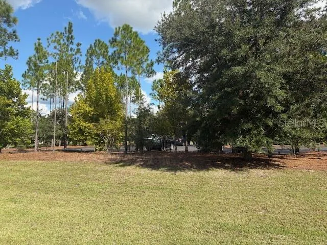 a view of swimming pool with an outdoor space and seating area