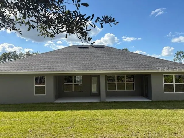 a house view with a swimming pool